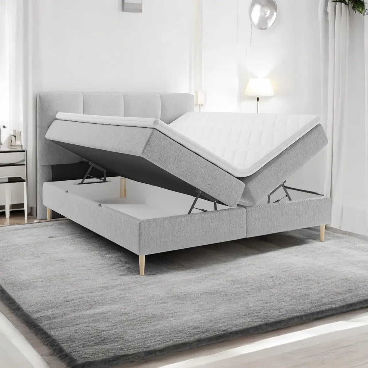 Lit BOXSPRING LEO - Avec tête de lit, coffre intégré, matelas ressorts ensachés et surmatelas inclus